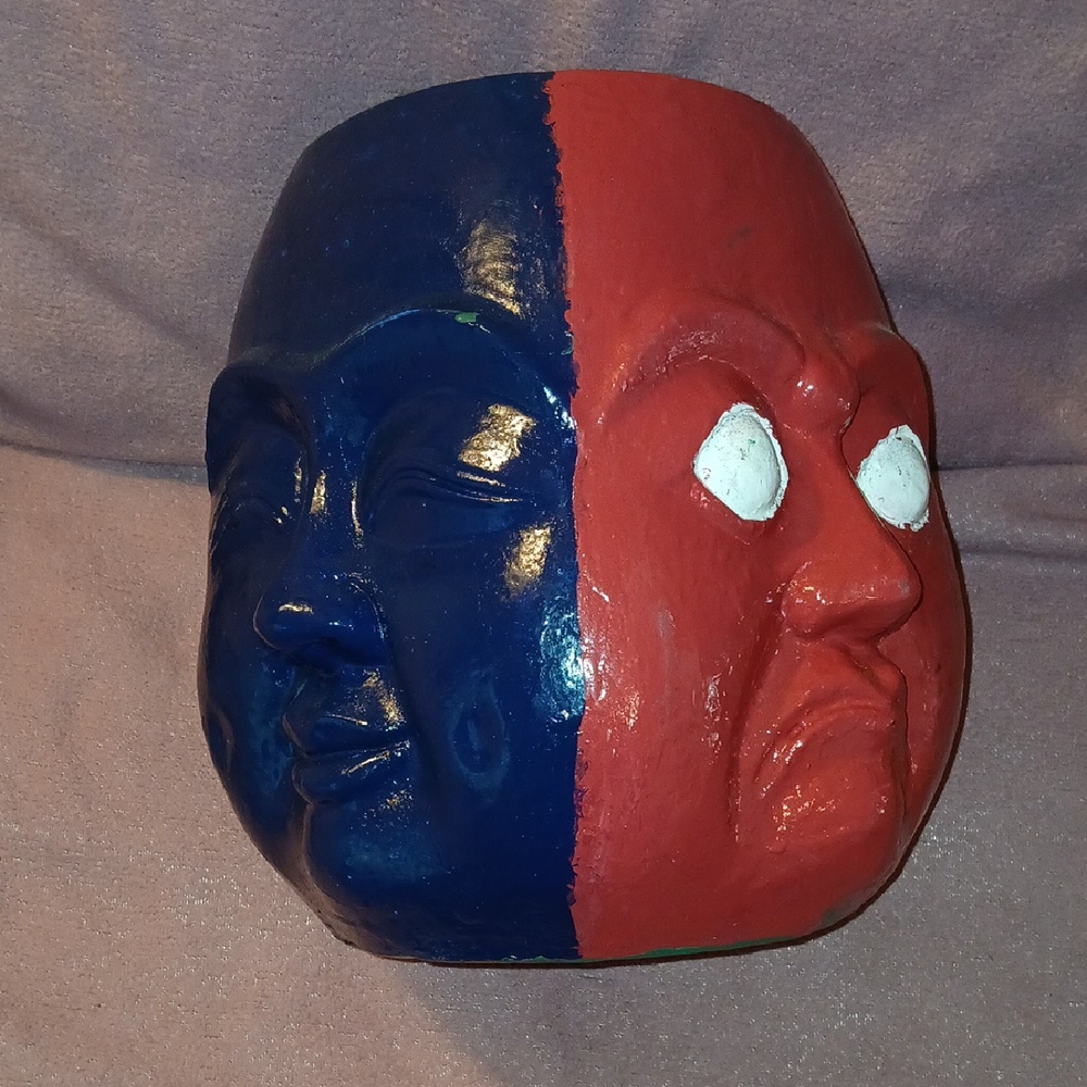 4 faced interior potter with each face being a different color.